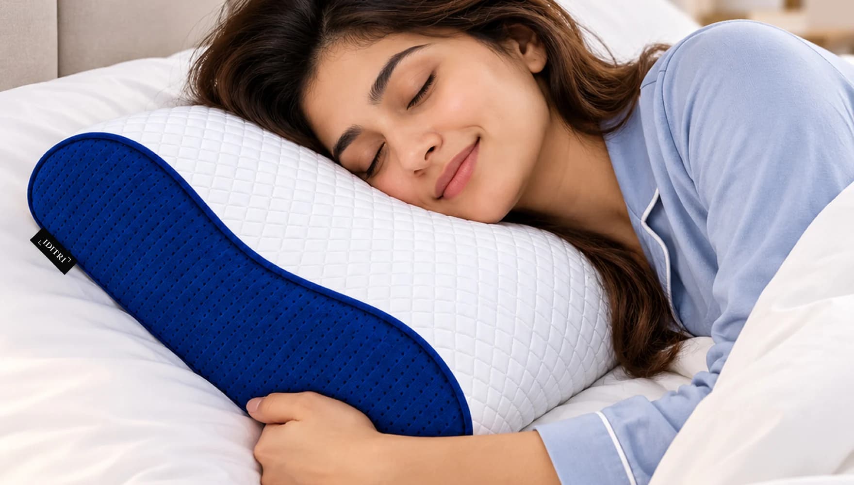 Woman sleeping on her side on an IDITRI pillow